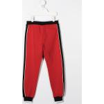 Pantaloni sportivi scontati rossi a righe per bambini Moschino Kids 
